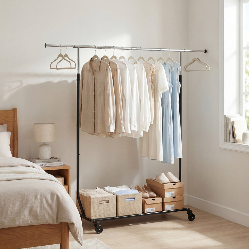 Extendable rolling clothes rack with hanging capacity, metal frame, and storage bins, ideal for bedrooms and laundry.