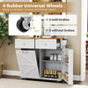 Rolling kitchen island in grey with drop leaf top, storage drawers, and 4 rubber wheels for easy mobility.