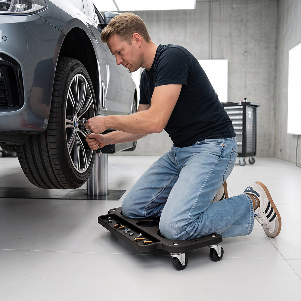 Rolling knee creeper with 360° swivel casters and contoured EVA foam pads for comfortable use during repairs.