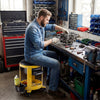 Rolling mechanic stool in yellow with padded seat, drawers, and tool tray, ideal for garage work and repairs.