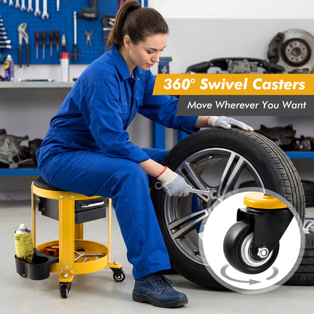 Rolling mechanic stool with removable padded seat, yellow, featuring 360° swivel casters for easy movement and tool.