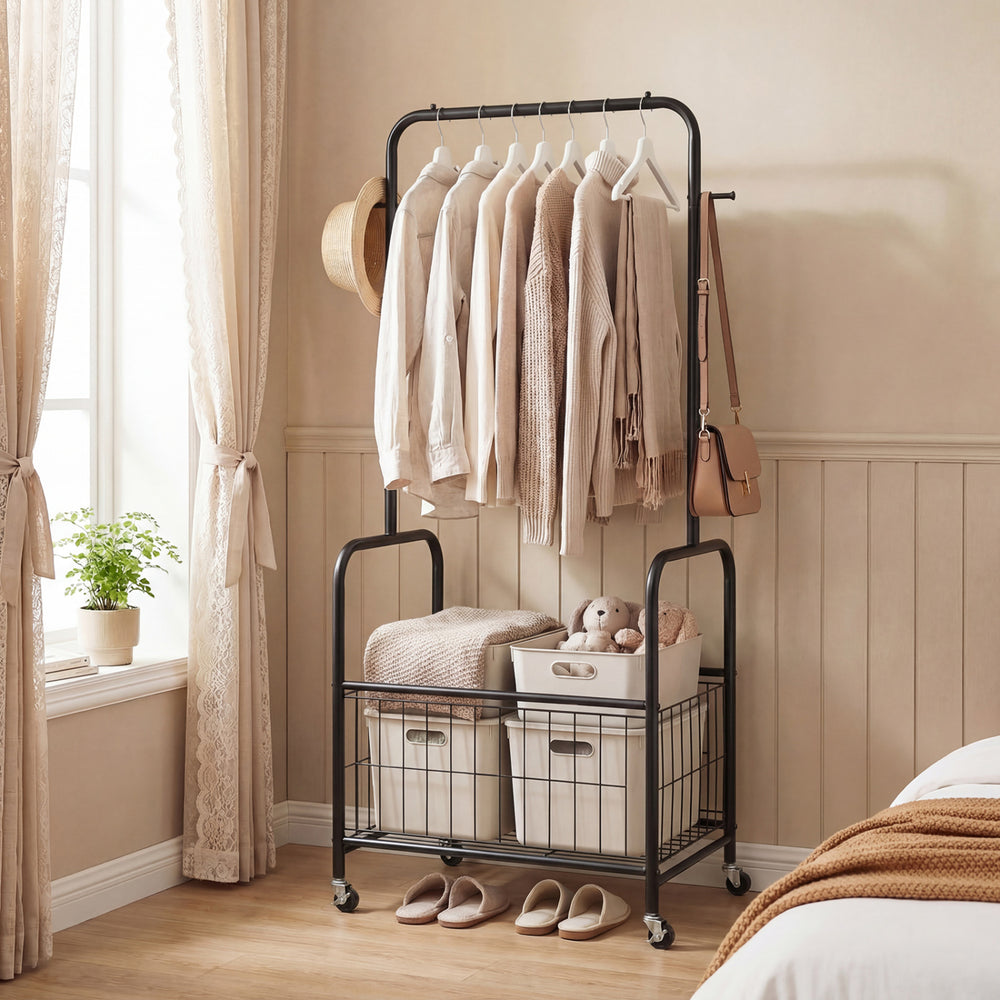 Rolling metal clothes rack with hanging rod and storage basket in black, ideal for organizing clothes and accessories.