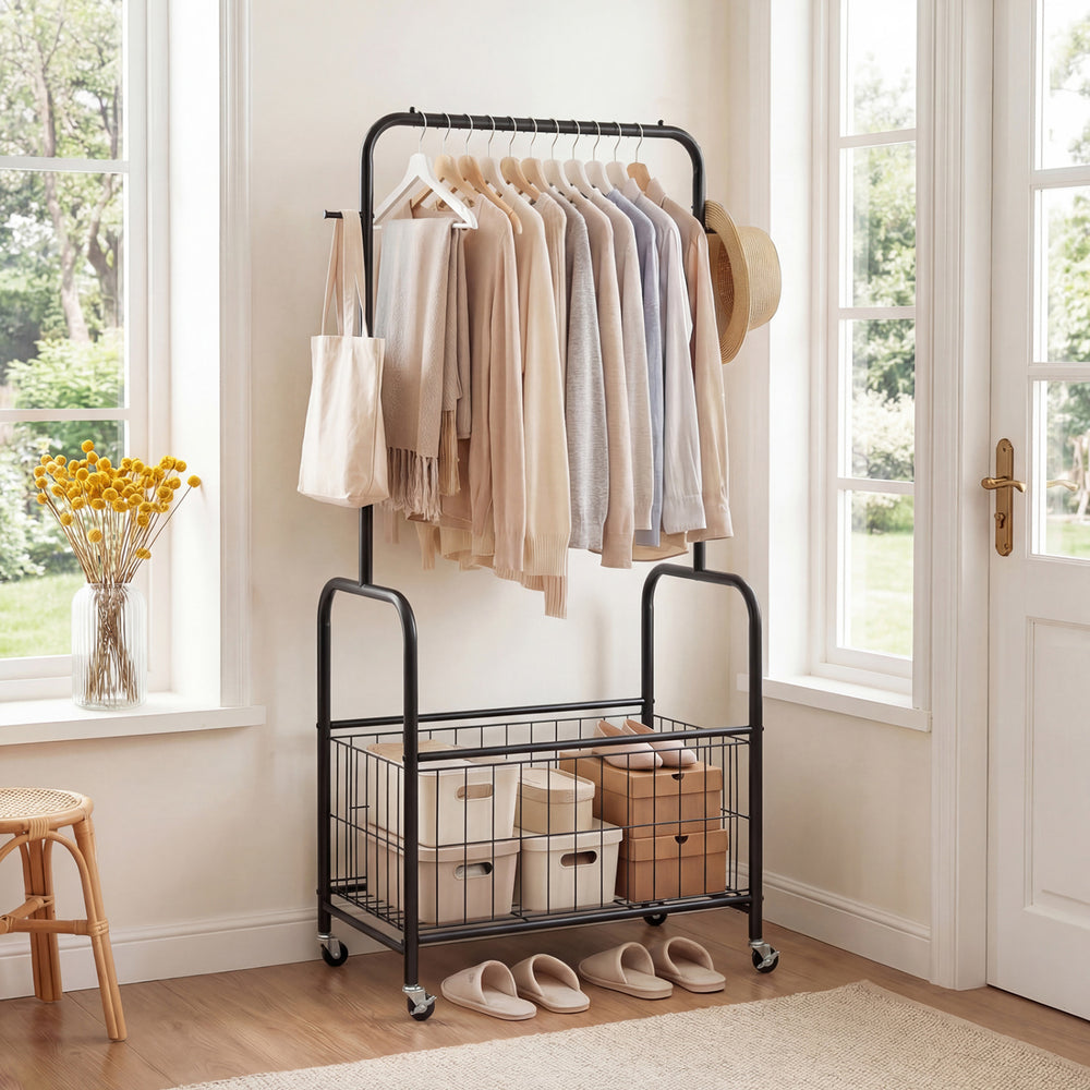 Rolling metal clothes rack in black with hanging rod and storage basket, perfect for organizing clothes and accessories.