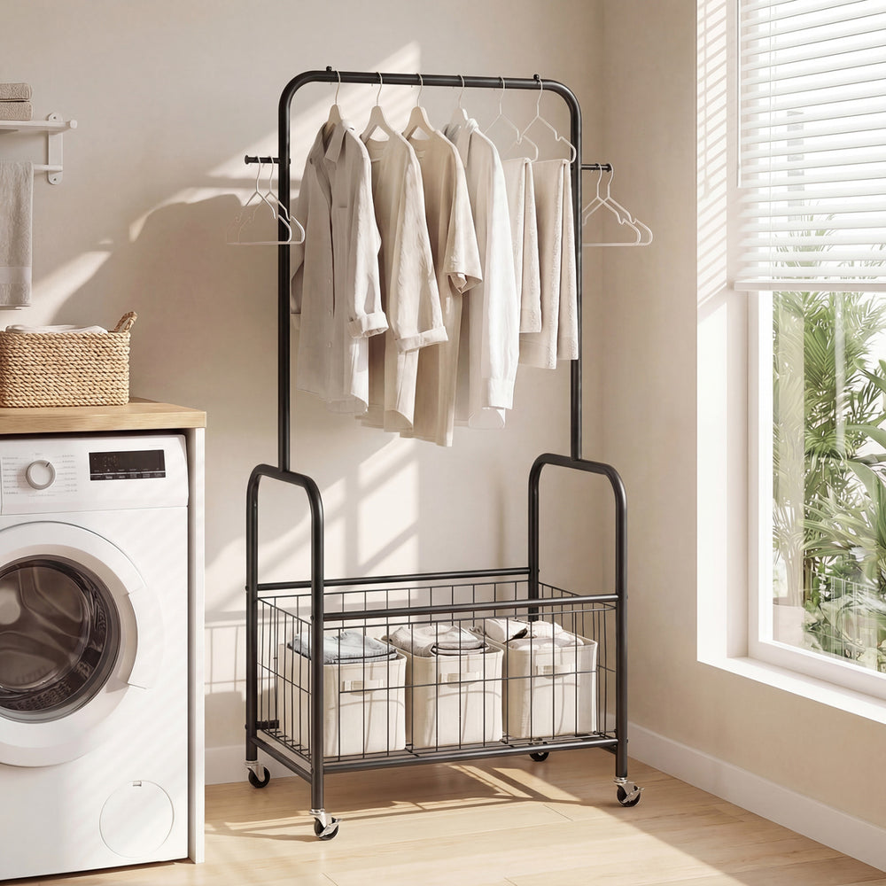 Rolling black metal clothes rack with hanging rod and storage basket, ideal for laundry rooms and bedrooms.