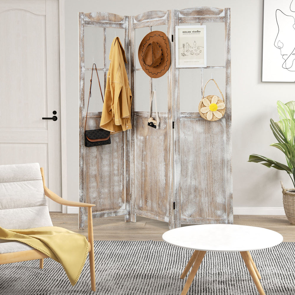 Folding privacy screen in retro design with mesh windows, made of paulownia wood, ideal for room division and decor.