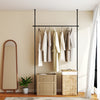 Adjustable black tension rod for curtains, 4-10 ft height, drill-free installation, ideal for bedrooms and studios.