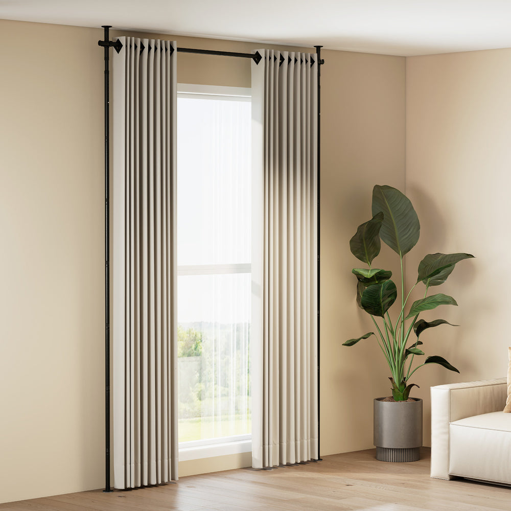 Adjustable black room divider curtain rod with floor-to-ceiling tension, suitable for various room layouts and no.