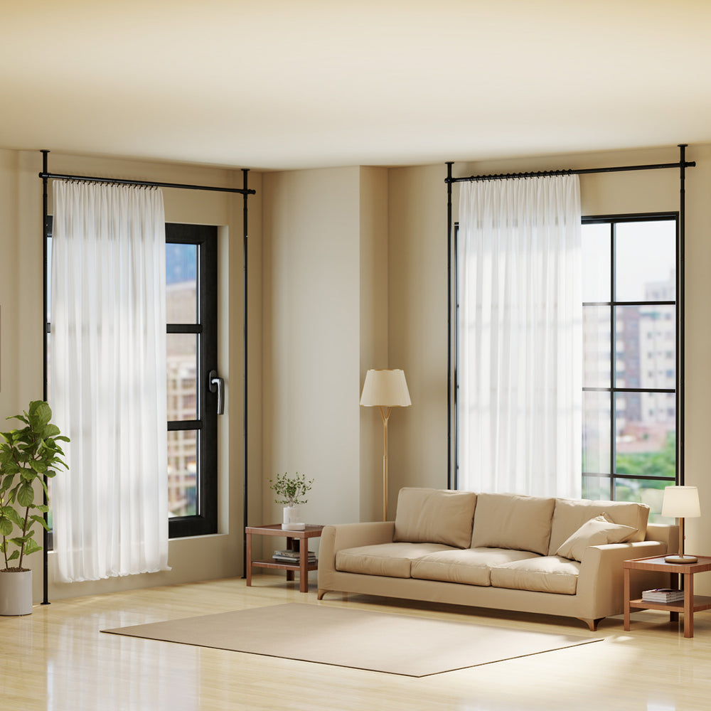 Adjustable black tension rod for floor-to-ceiling installation, suitable for various curtain types in modern living.