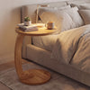 C-shaped side table made of solid teak wood with a thickened top, perfect for bedside essentials and space-saving.