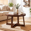 Round coffee table with walnut finish and sturdy rubber wood legs, perfect for organizing items in a living room.