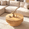 Round coffee table with fluted accents and a spacious surface, featuring a hidden compartment for convenient storage.