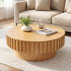 Round coffee table with fluted accents in natural wood, featuring hidden storage for living room essentials.