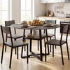 Round gray dining table for 4-6 with metal legs and storage shelf, perfect for family gatherings in the kitchen.
