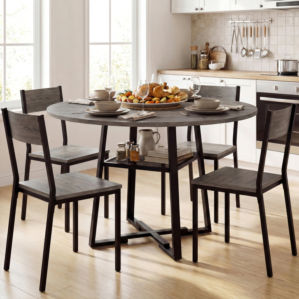 Round gray dining table for 4-6 with metal legs and storage shelf, perfect for family gatherings in the kitchen.