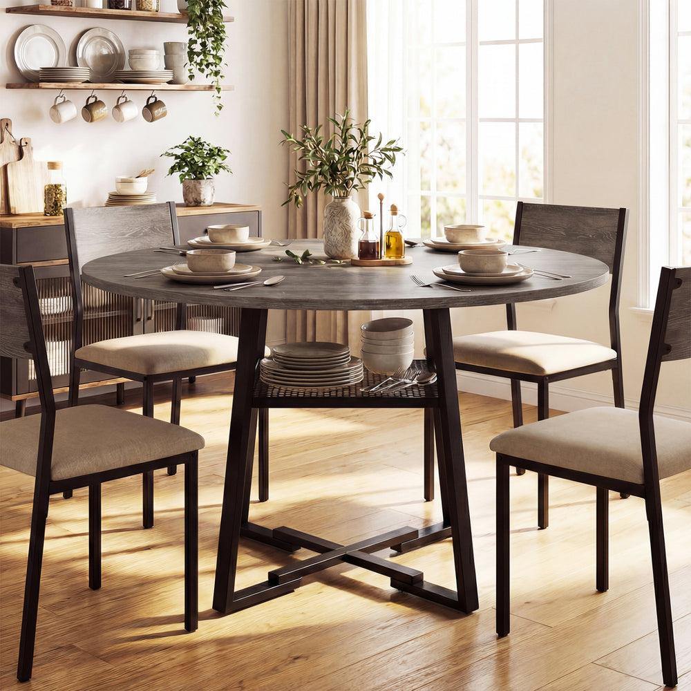 Round dining table featuring a metal mesh shelf, designed for 4-6, shown in a bright dining room setting.