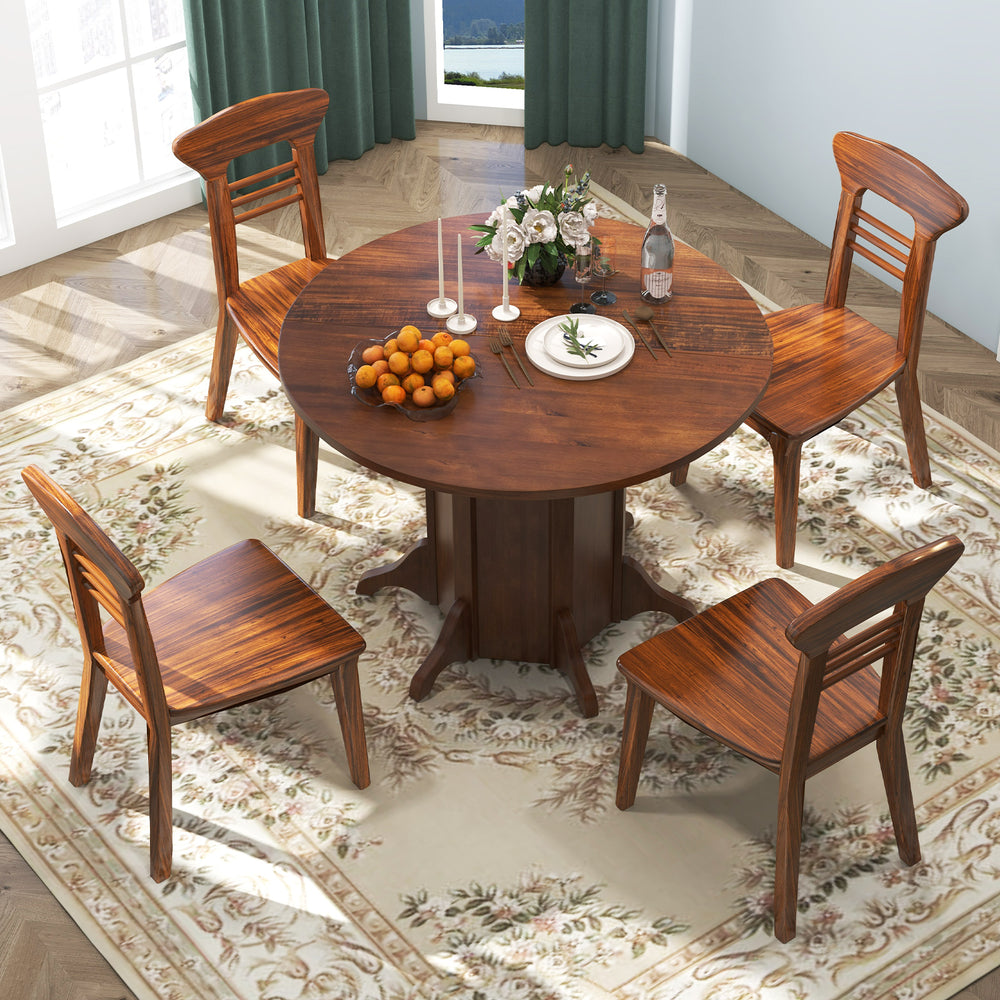 Round walnut dining table with pedestal base, seating 4-6, featuring a sturdy pine wood frame and elegant acacia veneer.