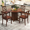 Round dining table with pedestal base in walnut finish, seating 4-6 people, perfect for kitchens and dining areas.