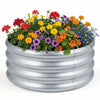 Round galvanized raised garden bed with vibrant flowers, featuring durable steel panels and open-ended base for.