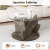 Round glass coffee table with a gray rubberwood base and tempered glass top, perfect for living room decor.