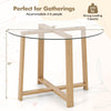 Round 42-inch glass dining table with natural rubber wood legs, perfect for gatherings of 4-6 people.