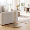 Round marble side table with a sleek gold pedestal base, enhancing modern decor in small living spaces.