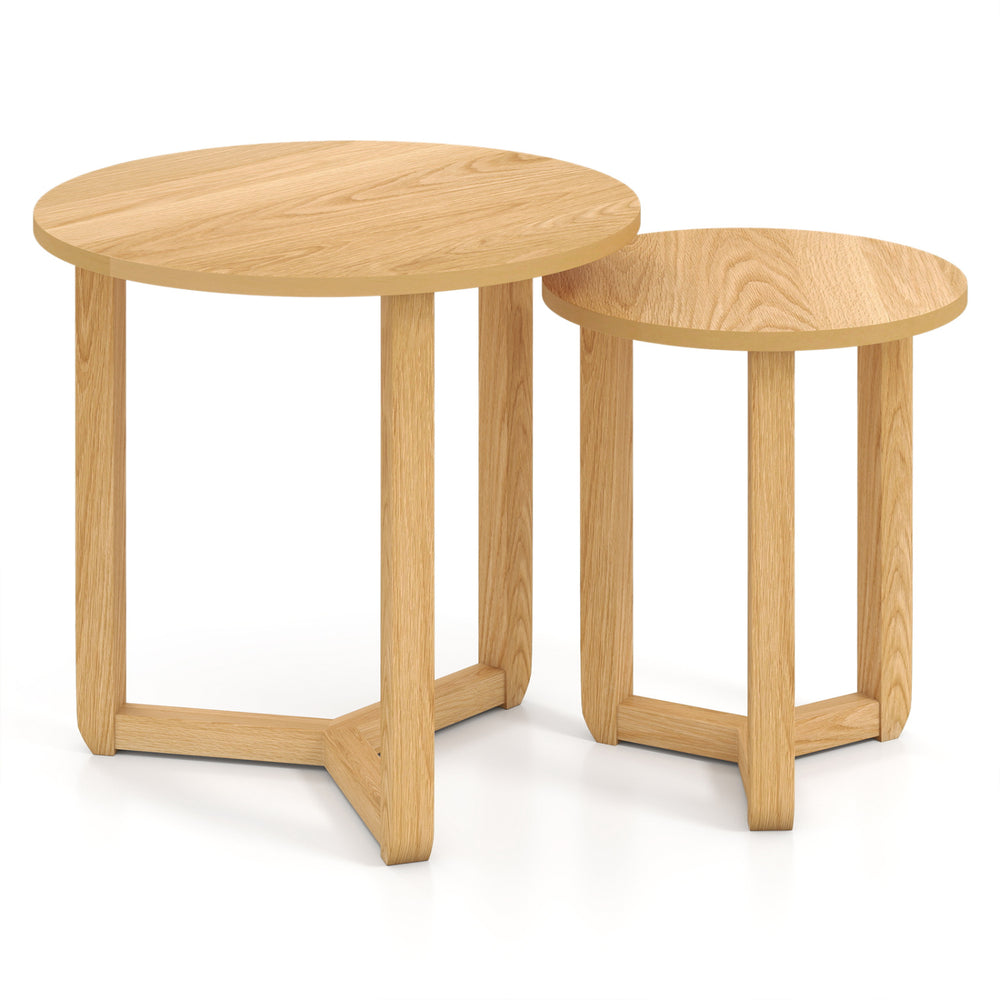 Round nesting coffee table set of 2 in natural rubber wood, featuring spacious tabletops and a stable tripod frame.