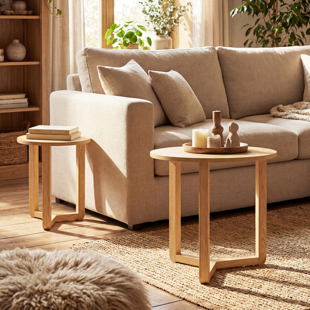 Round nesting coffee tables set of 2 in natural rubber wood, featuring spacious tabletops and a stable tripod frame.