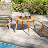 Round outdoor acacia wood side table with slatted tabletop, perfect for patio or poolside use.