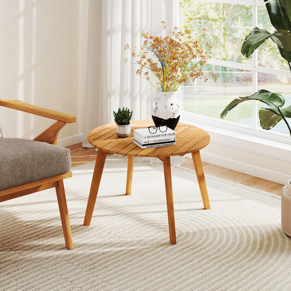 Round outdoor acacia wood side table with slatted tabletop, perfect for patio or garden use, showcasing natural charm.