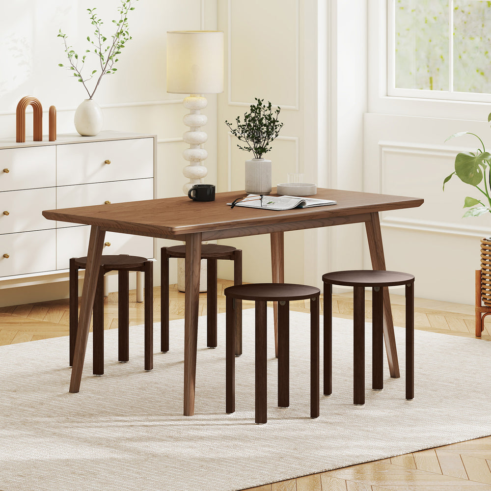 Round portable wood nesting stools in walnut finish, featuring lockable casters for easy mobility and space-saving.