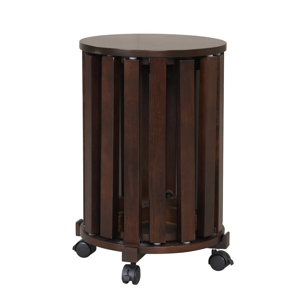Round portable wood nesting stool in walnut with a smooth surface and sturdy rubber wood legs, perfect for small spaces.