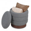 Round gray storage ottoman with acacia wood frame, showcasing soft boucle fabric and hidden storage for added comfort.