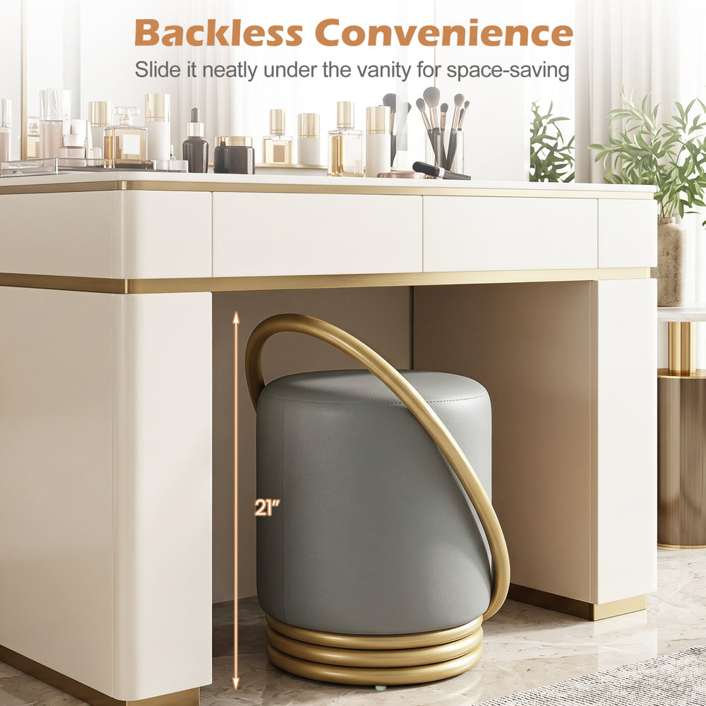 Round grey vanity stool with gold halo design, upholstered faux leather, perfect for makeup rooms and space-saving.