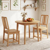 Natural rubber wood dining chairs with ergonomic hollowed backrests, perfect for comfortable dining experiences.