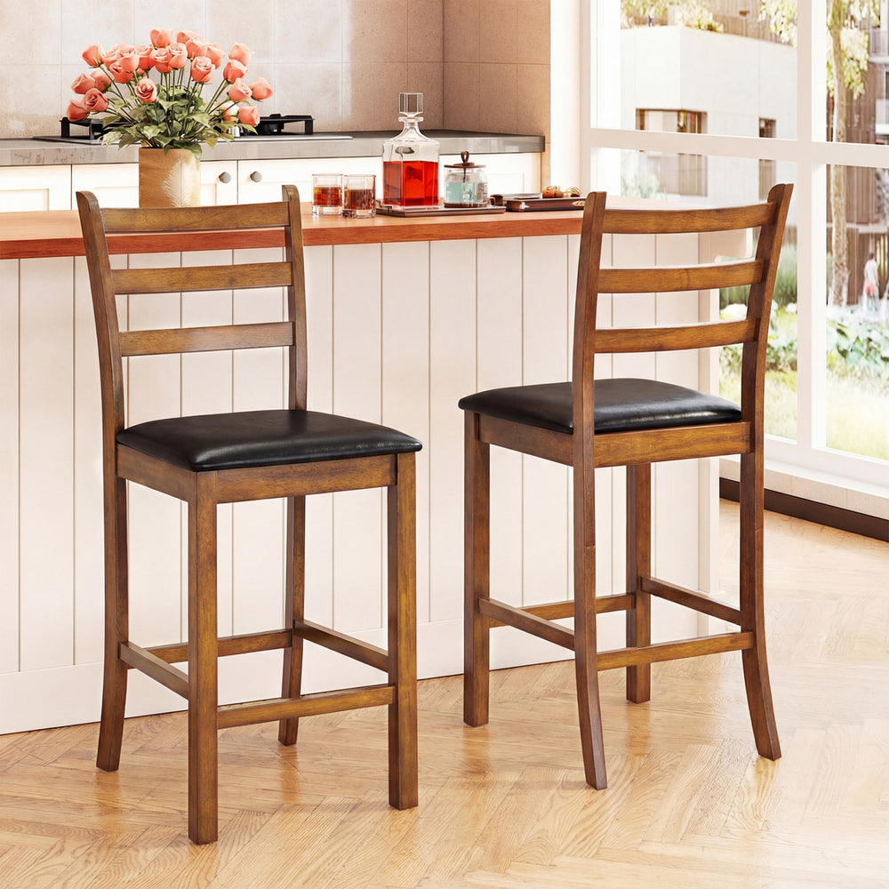 Set of 2 walnut rubber wood bar stools with ladder backrests and upholstered seats, ideal for kitchen islands.