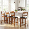 Set of two walnut rubber wood ladder back bar stools with black upholstered seats, perfect for kitchen islands.