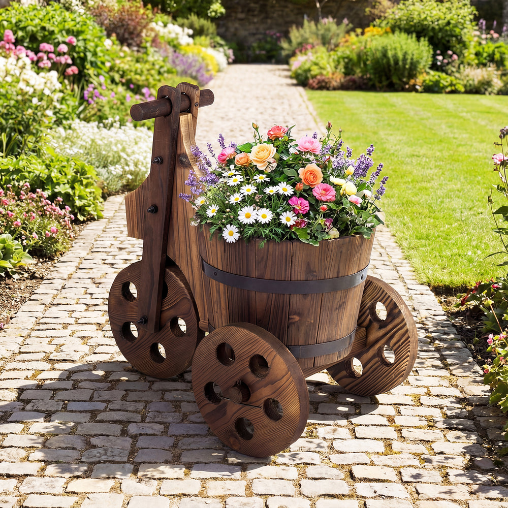 Rustic wood tricycle planter barrel with flowers, crafted from fir wood, features drainage hole and antique aesthetics.