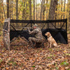 See-through hunting blind panel with camouflage pattern, featuring adjustable windows and dog door for enhanced hunting.