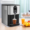 Self-dispensing nugget ice maker in silver, producing chewable ice cubes for refreshing drinks on a countertop.