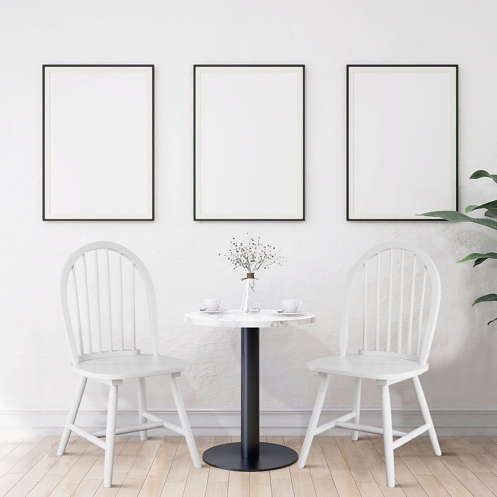 Vintage Windsor wood dining chairs in white with spindle back, offering ergonomic support and elegant style for dining.