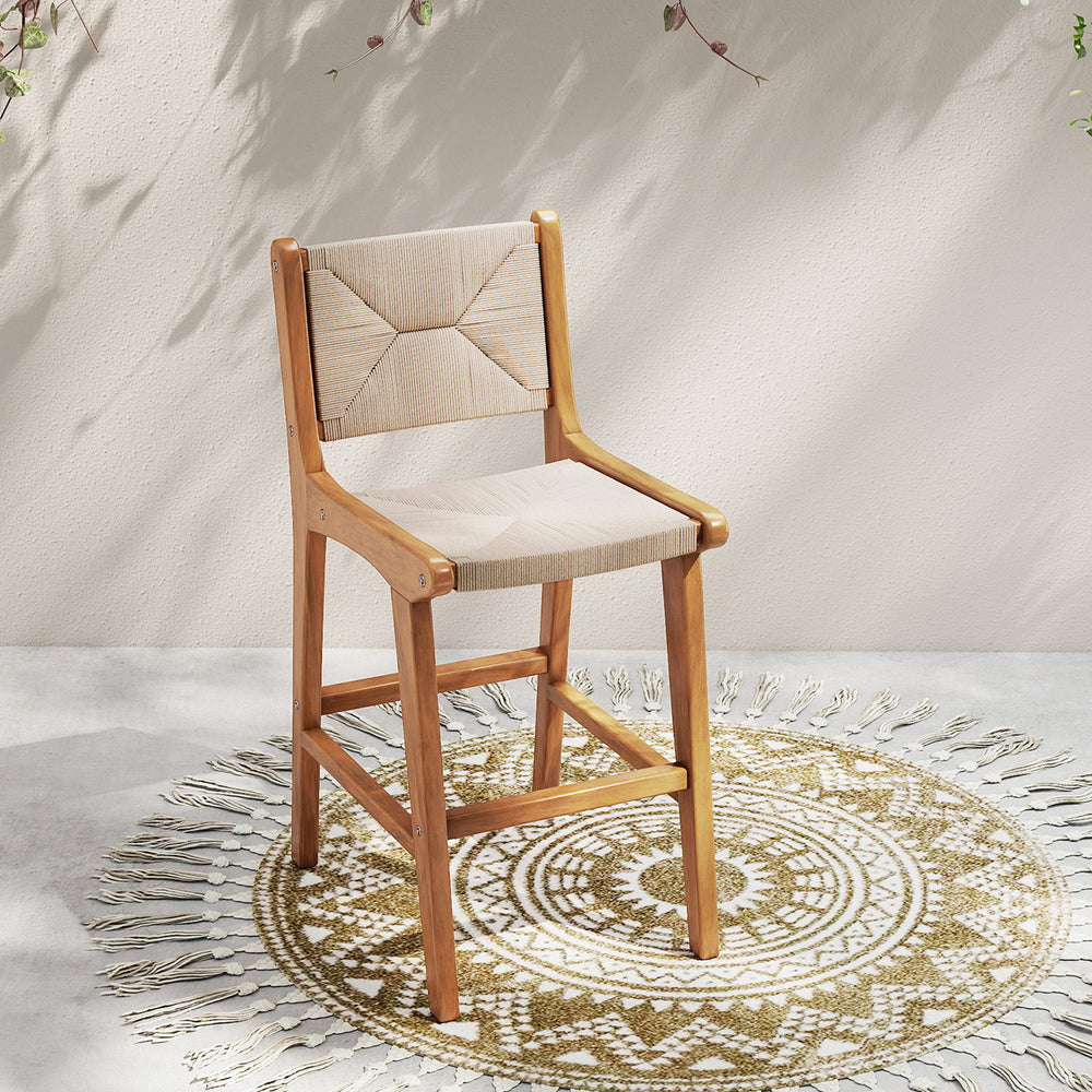 Outdoor counter height bar stool with teak wood frame and woven paper rope, perfect for patios and outdoor bars.