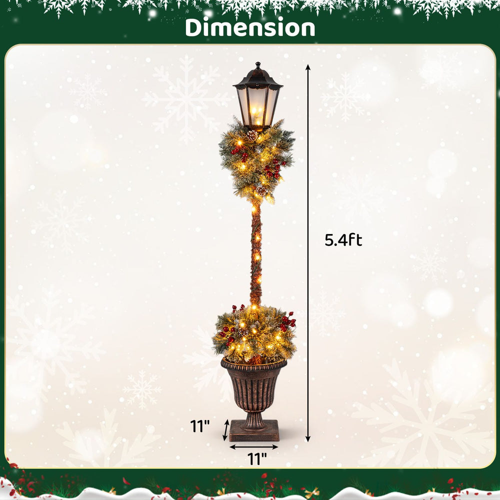 Lighted 5.4 FT outdoor Christmas lamp post decoration with LED lights, snow-flocked branches, and red berries for festive charm.