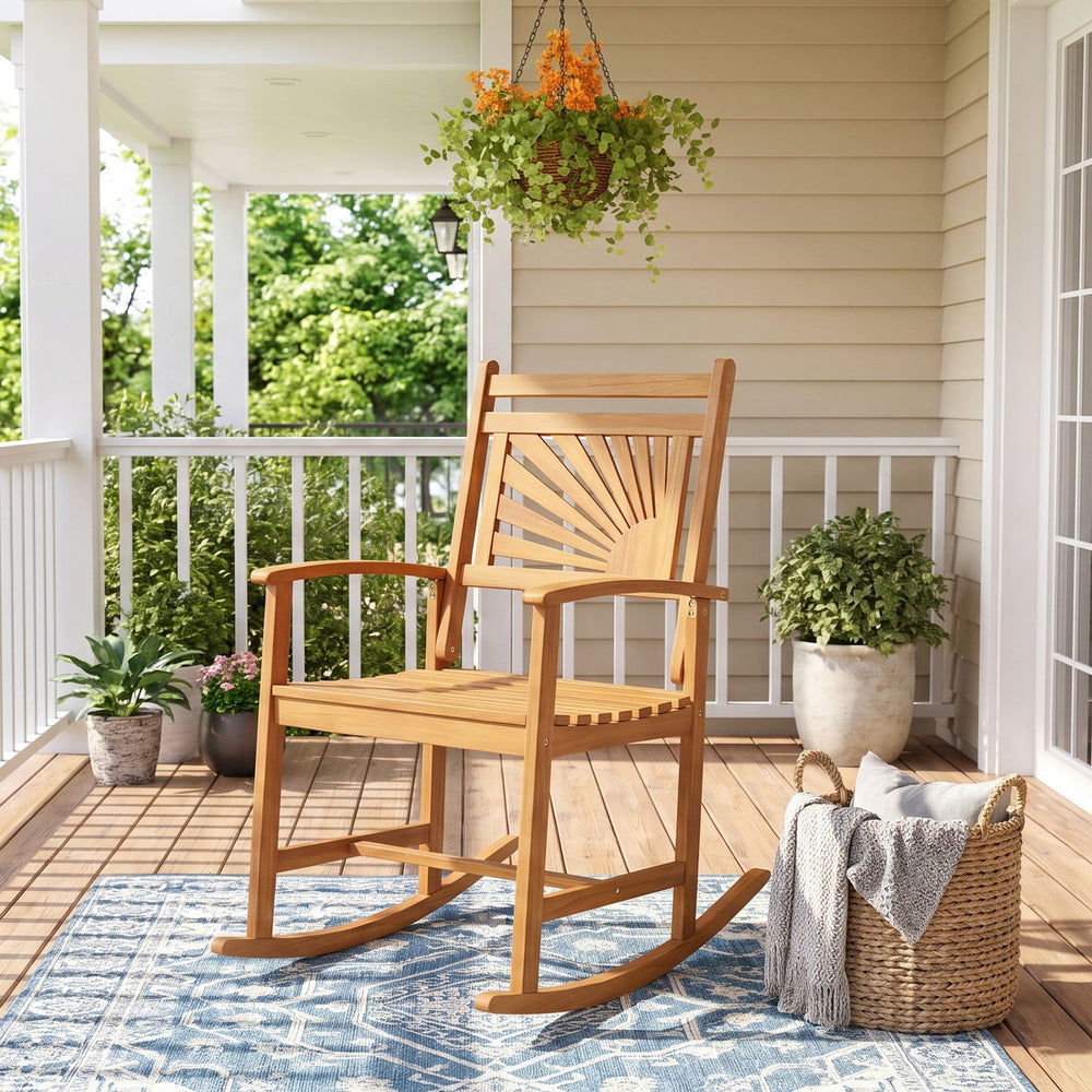 Acacia wood patio rocking chair with curved armrests offers a smooth rocking motion for relaxing outdoor spaces.