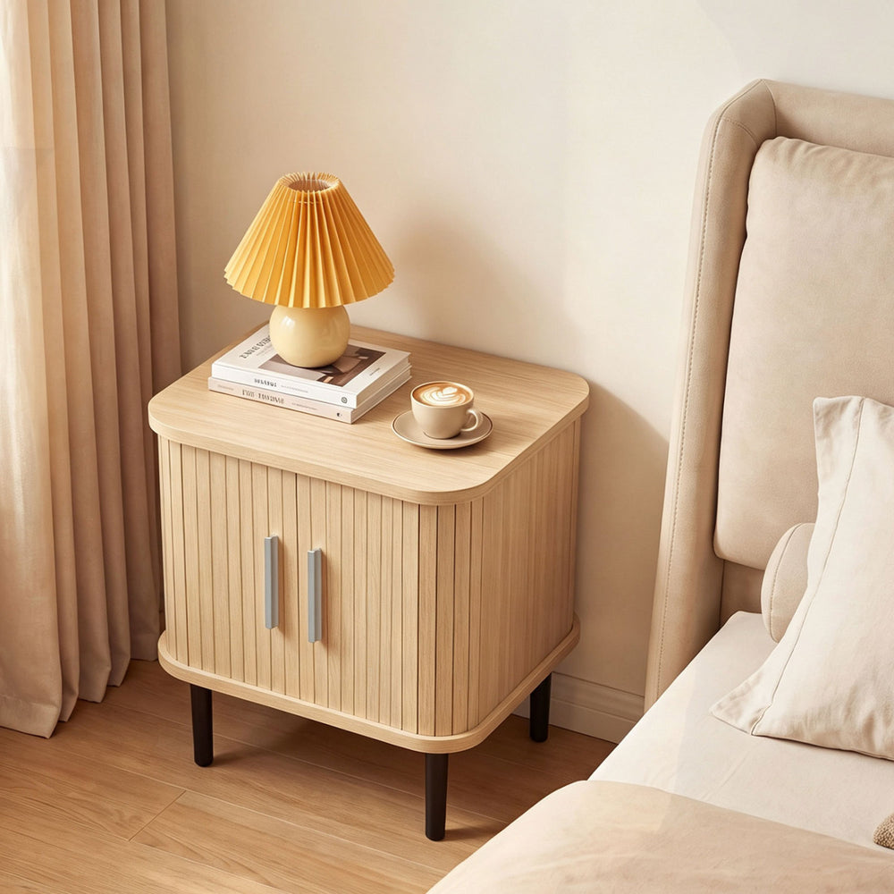 Fluted nightstand with sliding doors, adjustable shelf, and natural finish, perfect for small spaces and bedside essentials.