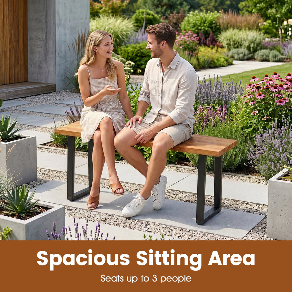Spacious acacia wood patio bench with U-shaped metal legs, comfortably seating up to 3 people for outdoor relaxation.