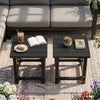 Set of 2 black outdoor Adirondack side tables with slatted surfaces, perfect for poolside use and low-maintenance enjoyment.
