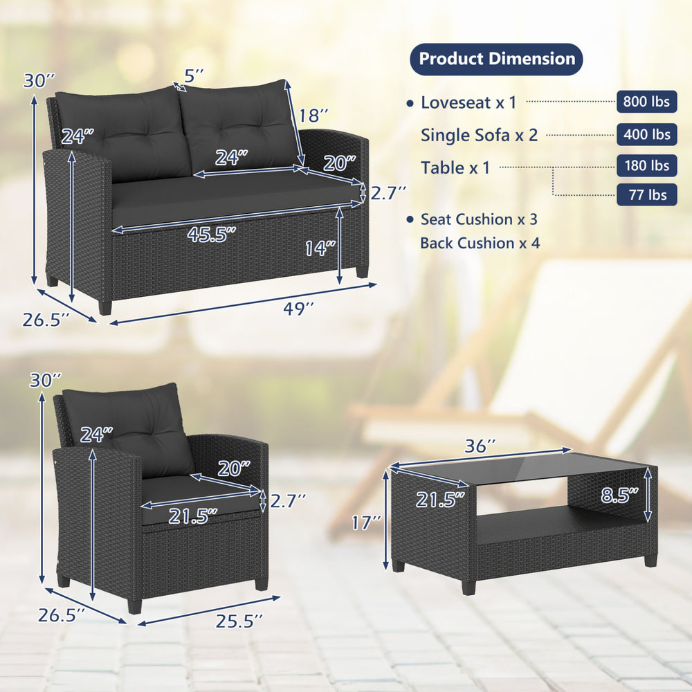 Loveseat and coffee table from a black patio rattan furniture set, featuring thick cushions and a tempered glass top.