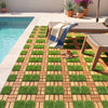 Interlocking deck tiles featuring acacia wood and artificial grass, ideal for outdoor patios and easy installation.