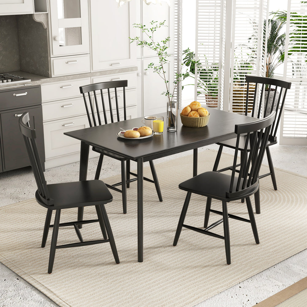 Set of 2 black Windsor dining chairs with high spindle backs, featuring rubber wood frames for durability and stability.