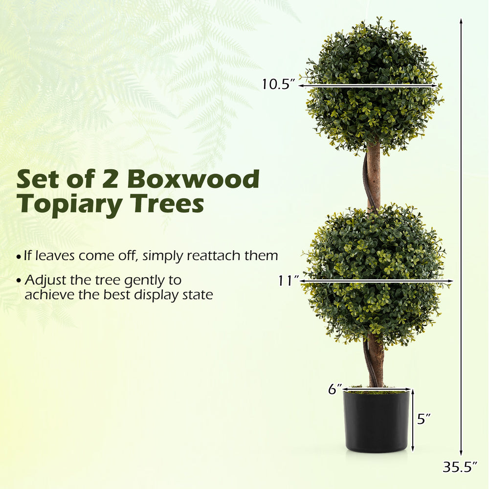 Set of 2 artificial double topiary ball trees with vivid leaves, solid birch trunk, and cement-filled pot for stability.